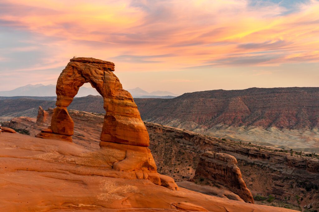 Sunset at Delicate Arch is one of the best things to do in Arches National Park